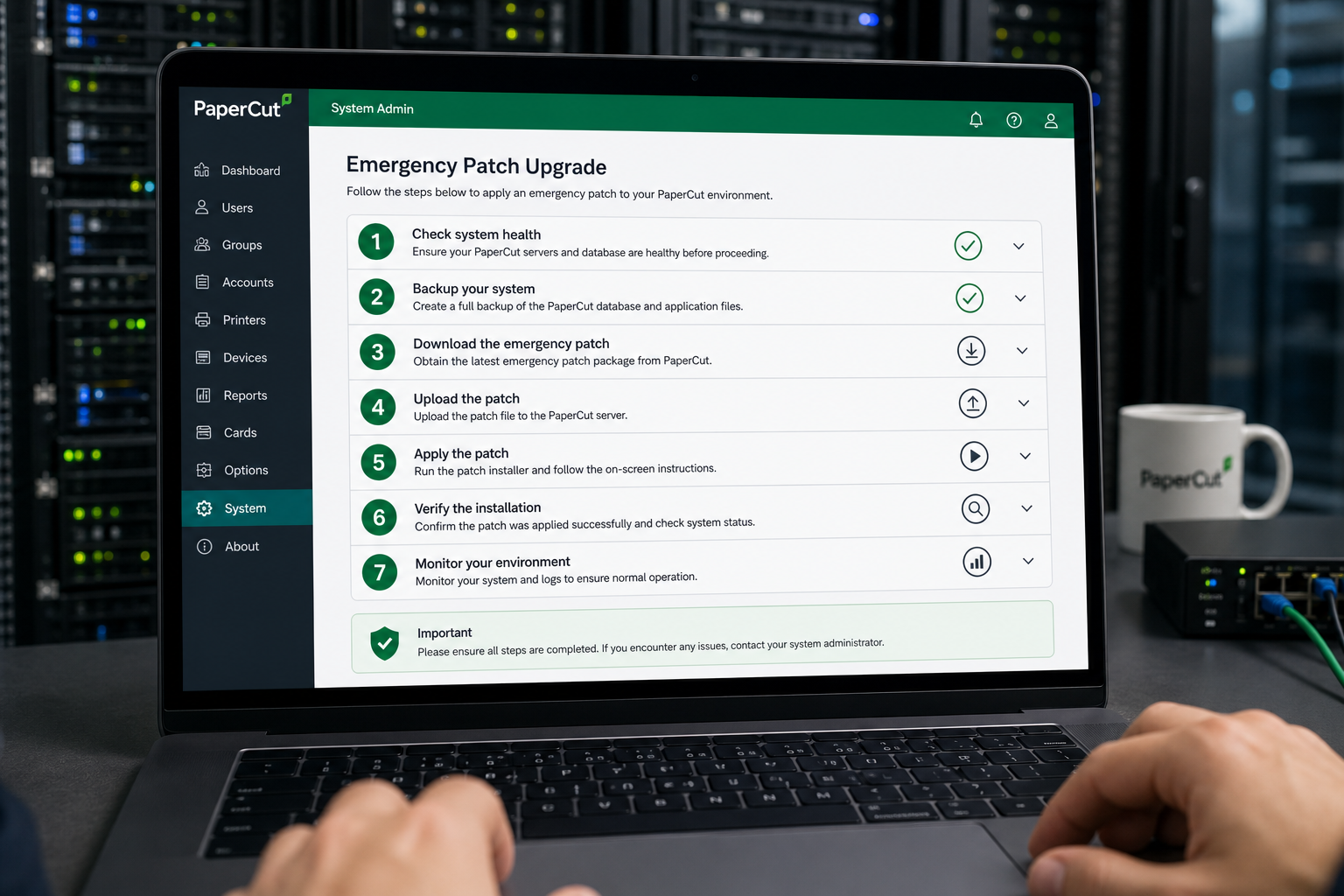 Server administrator applying PaperCut emergency patch upgrade checklist on laptop